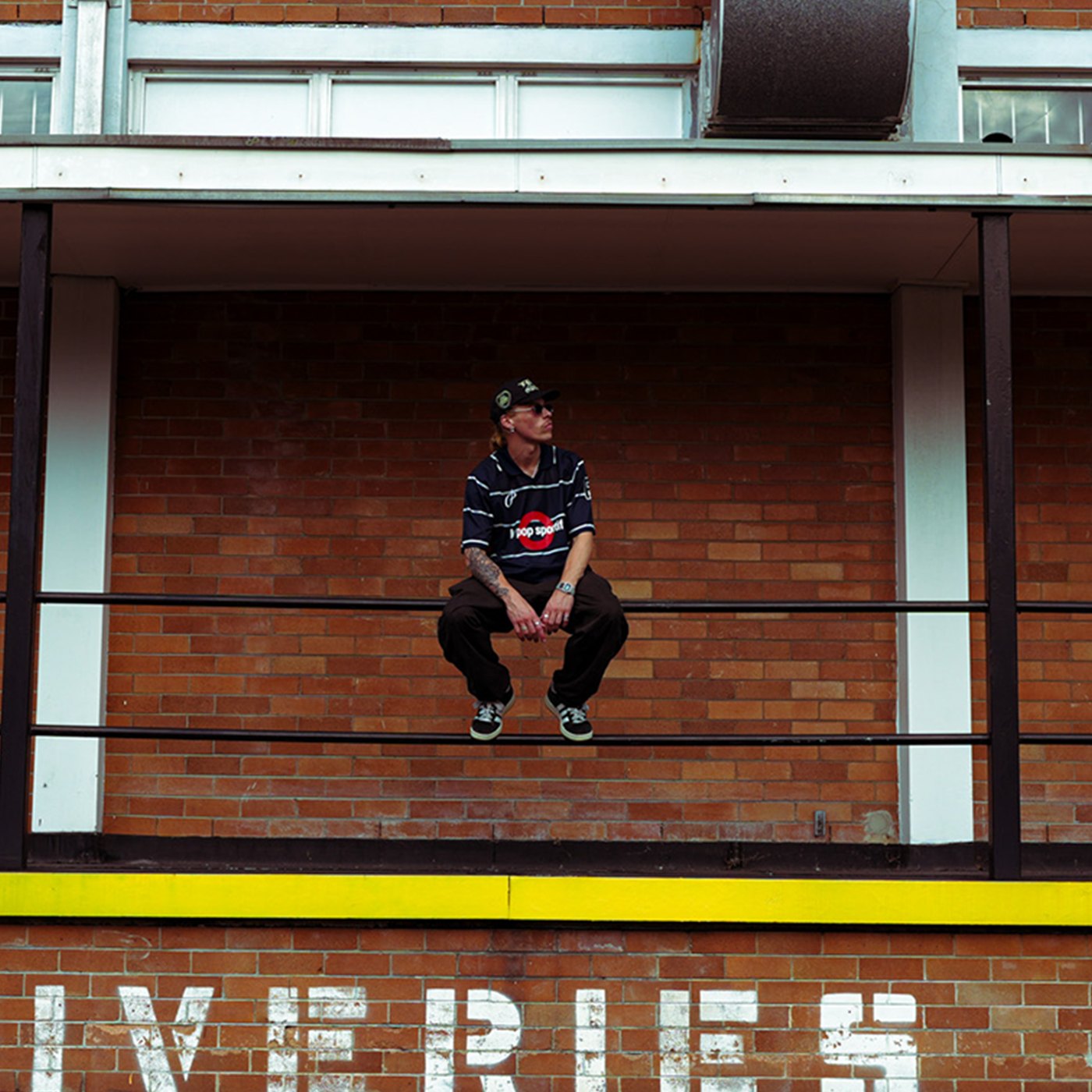 Louis Wall outside a brick building